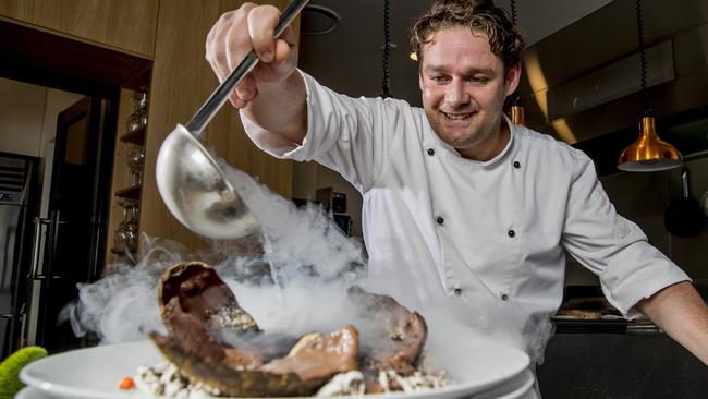 Dragonfly's owner and head chef Michael Smith with his concoction. Picture: Jerad Williams.