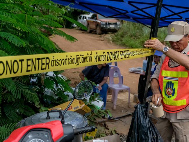 Police cordon off the area to prevent press from entering the main road leading to Tham Luang Nang Non cave. Picture: Getty Images