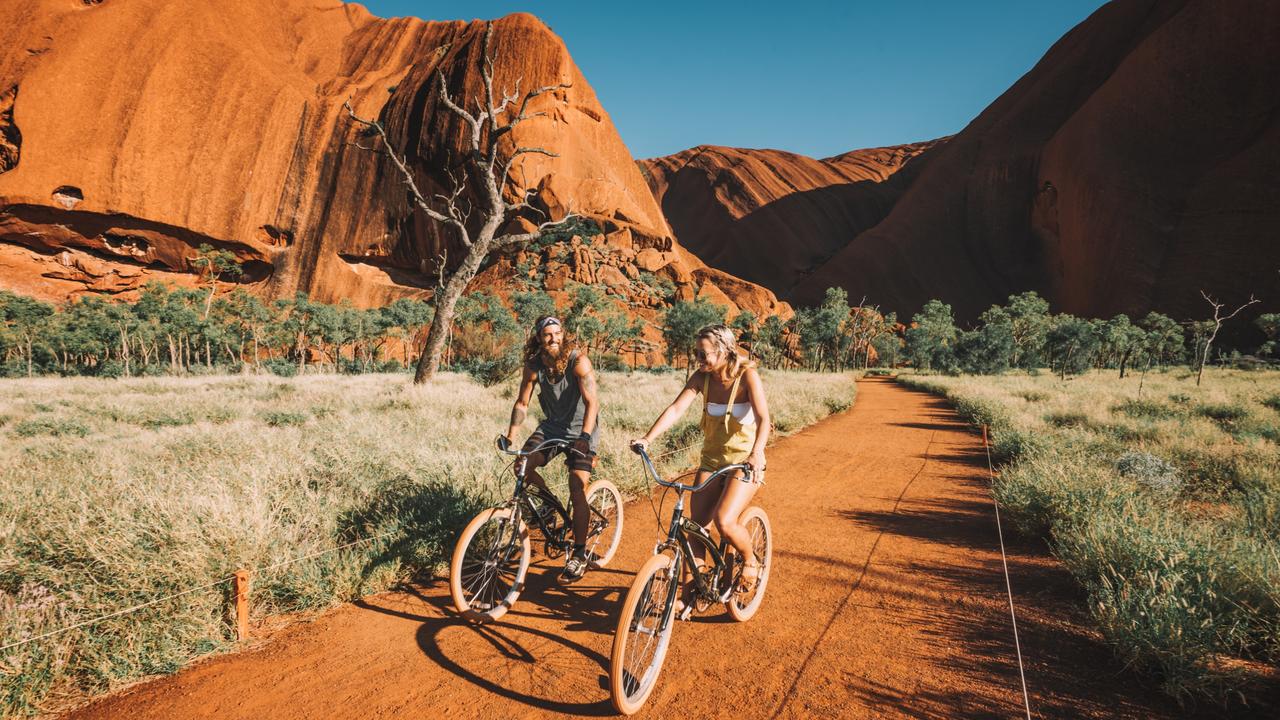 Go for a cycle around Uluru. Picture: Laura Bell/Tourism NT