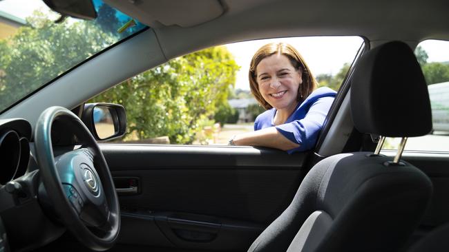 Queensland LNP opposition leader Deb Frecklington visits with a family with four cars in the suburb of Mansfield. The family will receive $300 for each car as part of the LNP’s rego rebate pledge. Picture: NCA NewsWire / Sarah Marshall