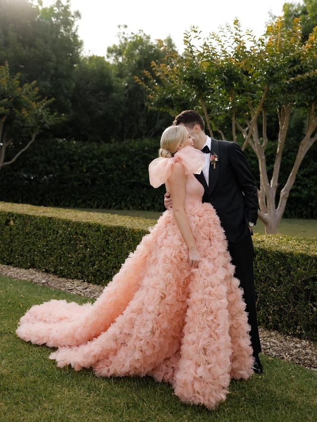 The bride wore a peach version of the couture+love+madness ‘Rose’ gown for her special day. Picture: Supplied/Karina Lee Studio