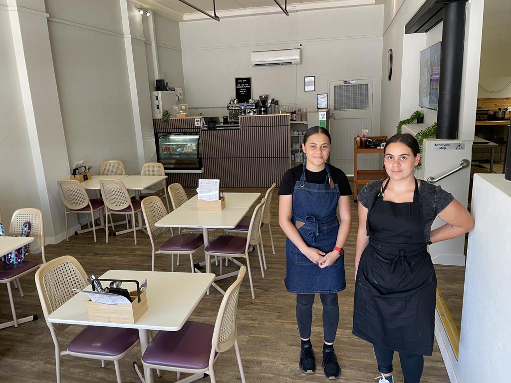 Cafe Nova co-owner Angel Houghton and staff member Iris Scott reveal the changed interior layout for their business. Picture: Leighton Smith.