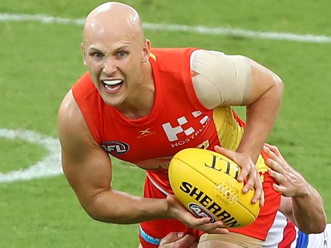 GOLD COAST, AUSTRALIA - MARCH 09: Gary Ablett of the Suns is tackled by Liam Picken of the Bulldogs during the JLTR Community Series AFL match between the Gold Coast Suns and the Western Bulldogs at Metricon Stadium on March 9, 2017 in Gold Coast, Australia. (Photo by Chris Hyde/Getty Images)