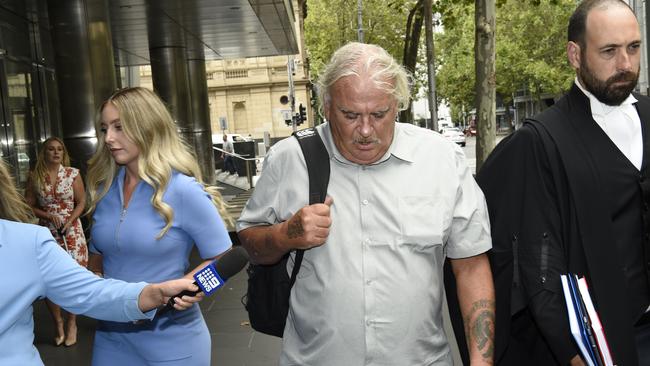 Jeffrey "Joffa" Corfe, former leader of the Collingwood AFL cheer squad, leaves court after pleading guilty to sexual penetration of a child. Picture: Andrew Henshaw