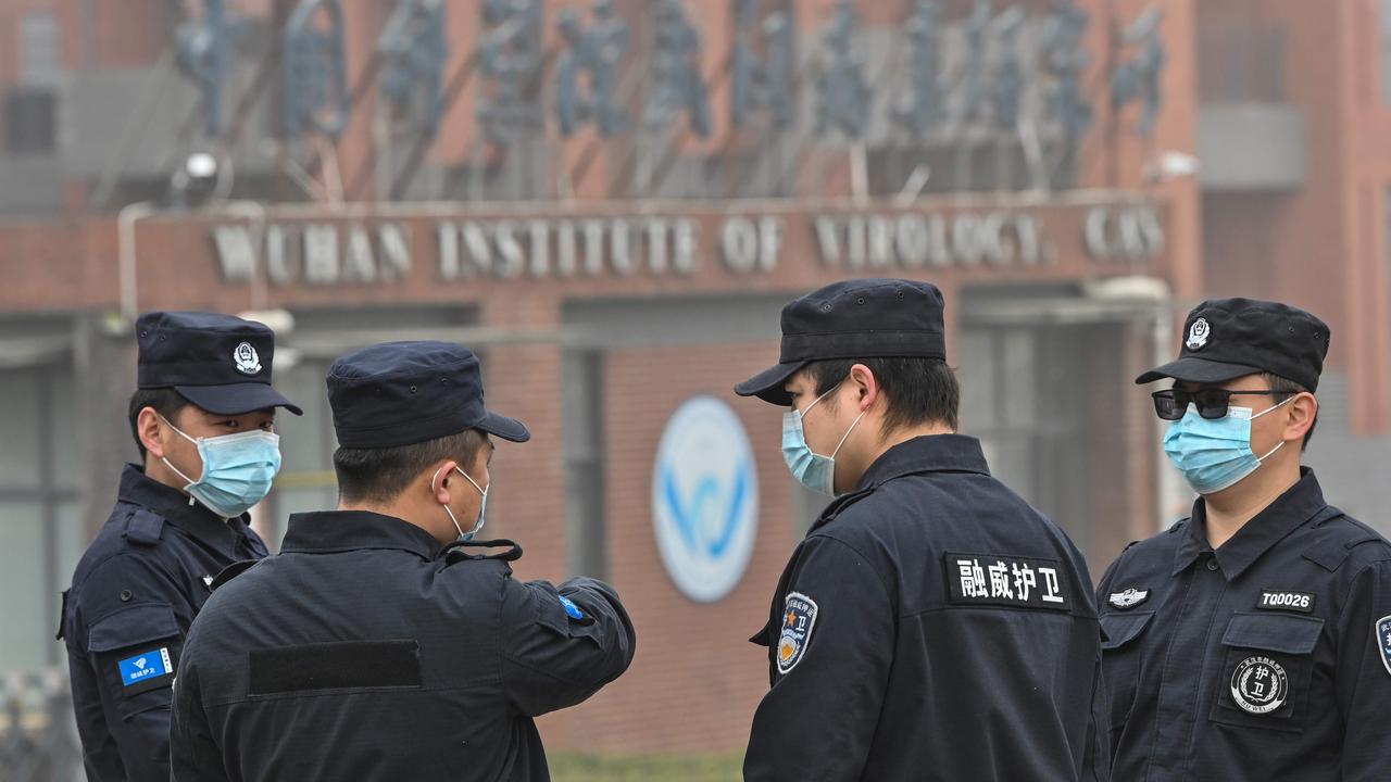 Security personnel stand guard outside the Wuhan Institute of Virology in Wuhan. Picture: Hector Retamal/AFP