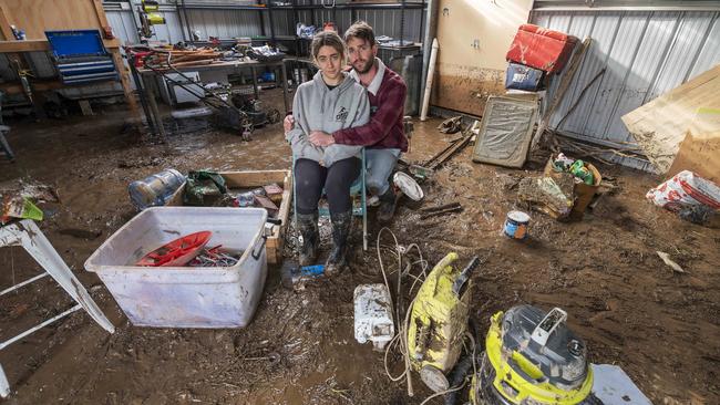 Laura and Kel Fitzclarence survey the mess after their property was flooded. Picture: Rob Leeson.