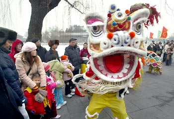 Mane attraction ... a lion dance entertains the crowd before the Lunar New Year holidays. Picture: AFP