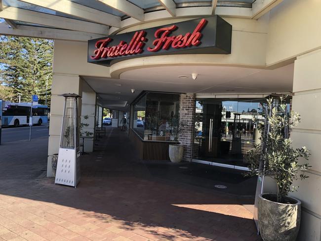 Members of the public shielded the boy from the large group of males to the Fratelli Fresh Italian restaurant opposite Manly Wharf. Picture: Jim O'Rourke