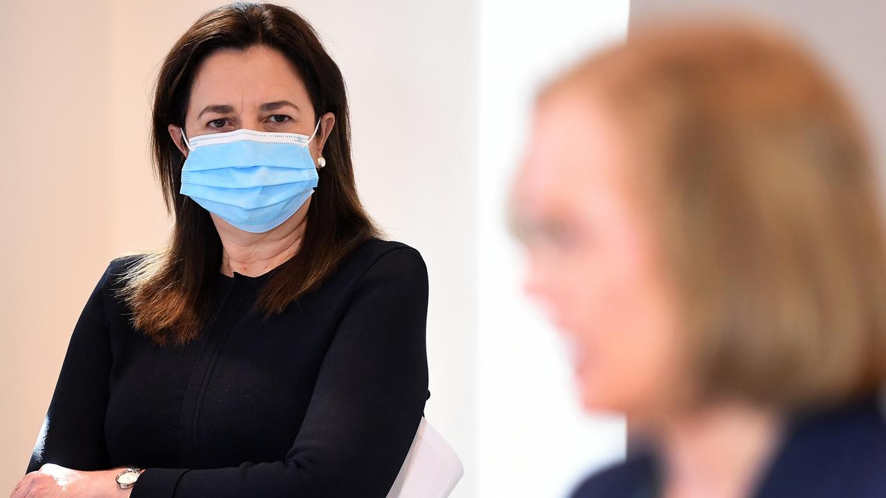 Premier Annastacia Palaszczuk watches Chief Health Officer Dr Jeannette Young during a Covid update on Wednesday. Picture: NCA NewsWire / Dan Peled