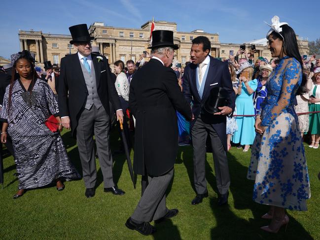 King Charles III speaks with Lionel Richie and Lisa Parigi during the Garden Party at Buckingham Palace. Picture: Getty