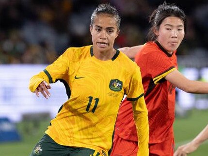 SYDNEY, AUSTRALIA - JUNE 3: Mary Fowler of Australia breaks through the challenge of China's Menglu Shen during the international friendly match between Australia Matildas and China PR at Accor Stadium on June 3, 2024 in Sydney, Australia. (Photo by Steve Christo - Corbis/Corbis via Getty Images)