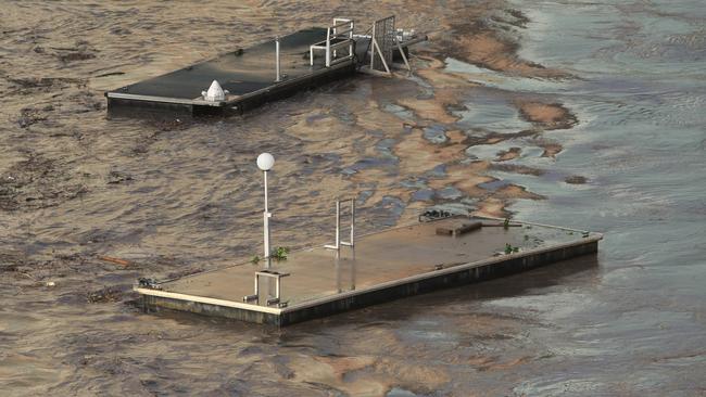 Riverwalk pontoons broke free and floated down the Brisbane River in the 2011 floods. Picture: Peter Wallis