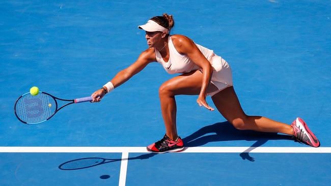 Madison Keys stretches for a forehand against eighth seed Caroline Garcia in their fourth-round match. Picture: Getty