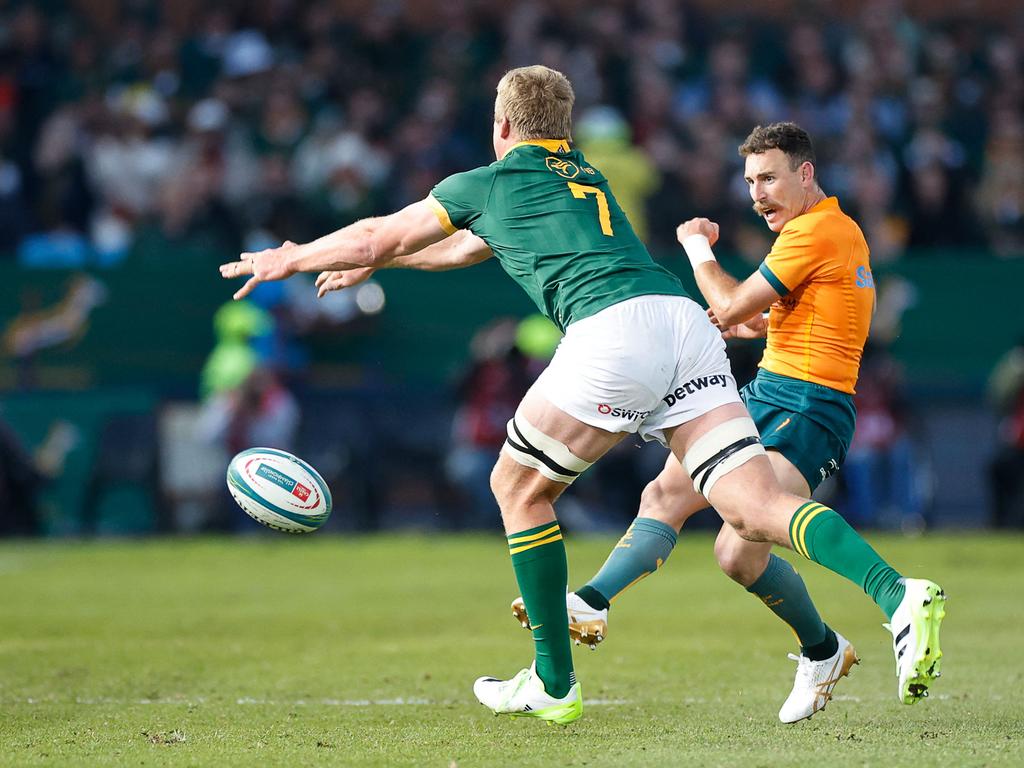 Wallabies halfback Nic White (right) gets a kick away during Australia’s loss to South Africa. Picture: PHILL MAGAKOE / AFP