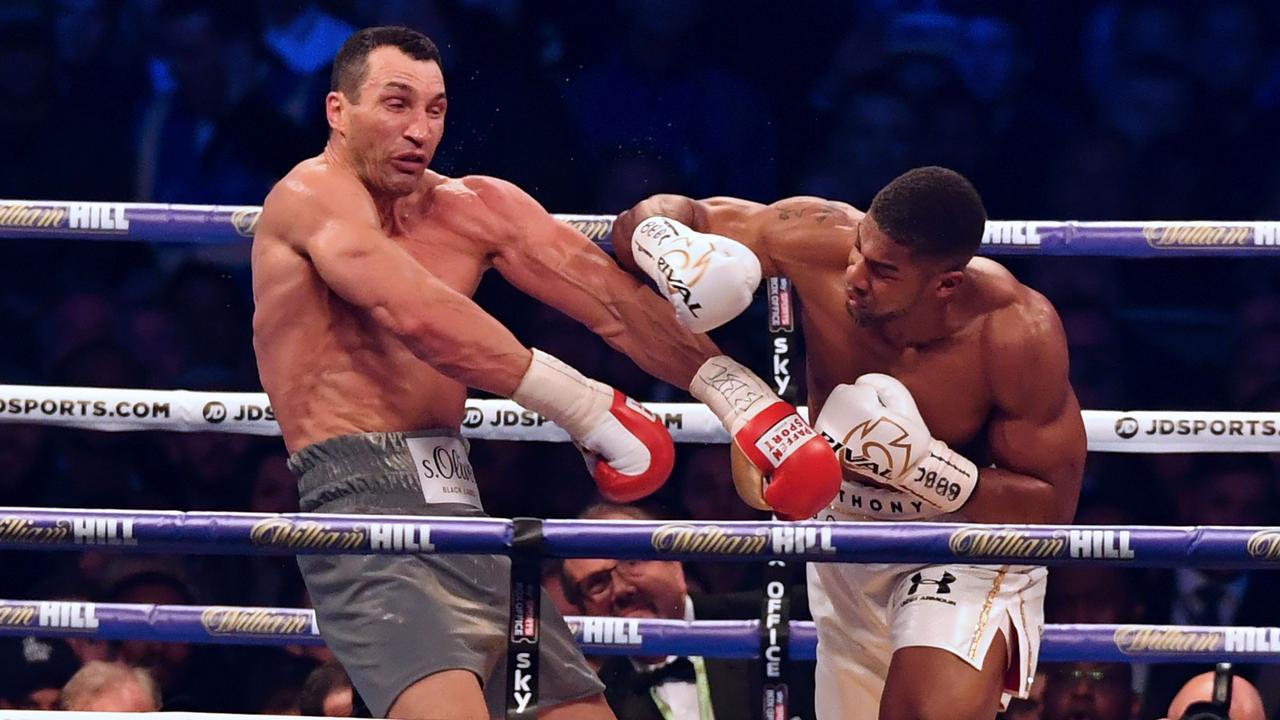 Anthony Joshua punches Wladimir Klitschko during the fourth round of their world title fight. Picture: AFP PHOTO/Ben STANSALL