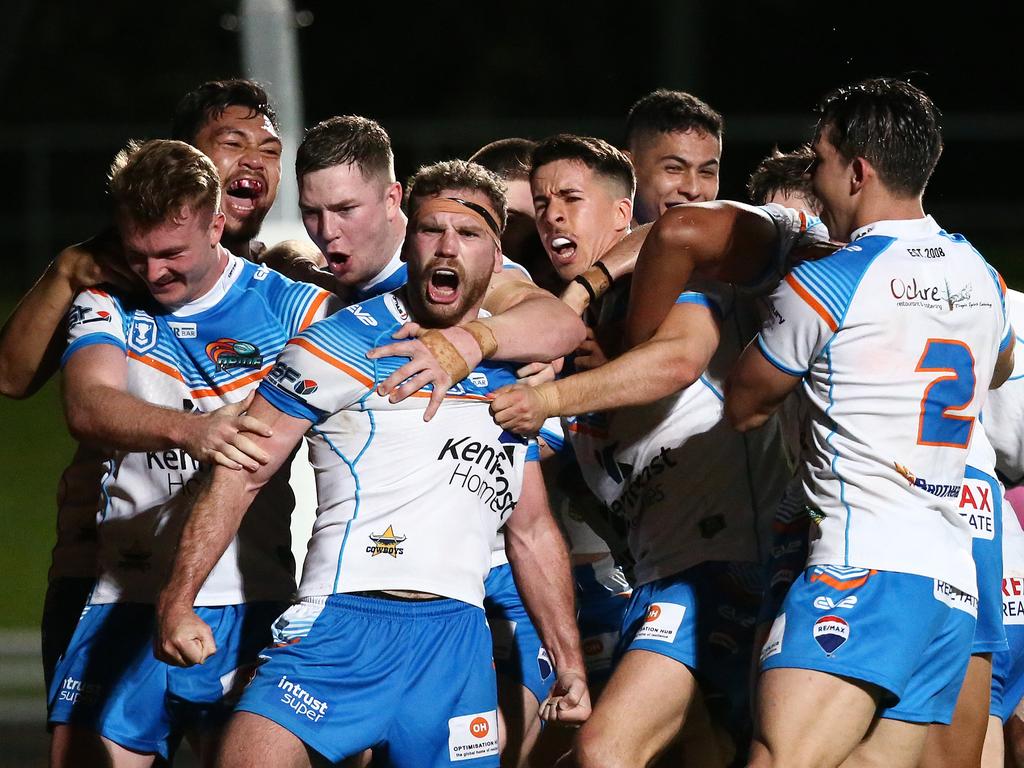 Pride's Chris Ostwald is surrounded by happy teammates after muscling his way over the try line in the Intrust Super Cup Queensland Rugby League match between the Northern Pride and the Souths Logan Magpies, held at Barlow Park, Cairns. Picture: Brendan Radke