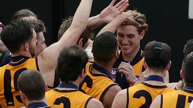 Ryan Schoenmakers is congratulated by teammates on his premiership medal in 2015. Picture: George Salpigtidis