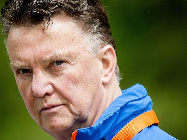 (FILES) In this file picture taken on May 15, 2014 Dutch national football team coach Louis van Gaal trains the Dutch national football team in Hoenderloo, The Netherlands, for the upcoming Fifa World Cup in Brazil. Netherlands boss Louis van Gaal will take over as the new manager of Manchester United after the World Cup with Ryan Giggs as his assistant, the club announced on May 19, 2014. Van Gaal, 62, has signed a three-year contract to succeed David Moyes who was sacked in April after a disastrous run of results. AFP PHOTO/ANP KOEN VAN WEEL netherlands out