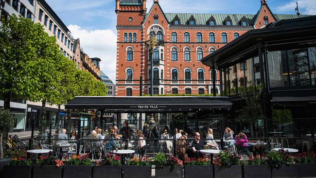 People sit in a restaurant in Stockholm. Picture: AFP