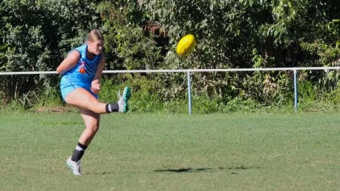 Wynnum Vikings player Ella Cook launching a kick.