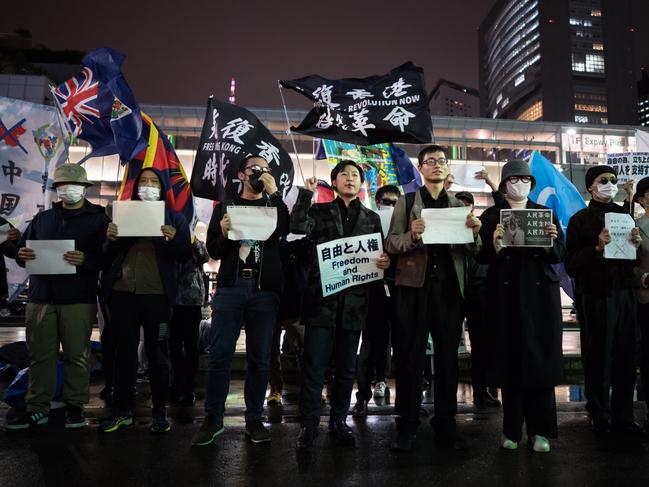 Protesters take part in a rally commemorating victims of China's Covid zero policy outside Shinjuku Station on in Tokyo, Japan. Picture: Getty Images