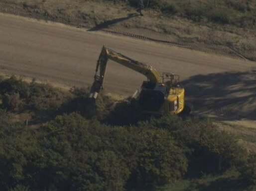 Police deploy an excavator to help in the search. Picture: Channel 9