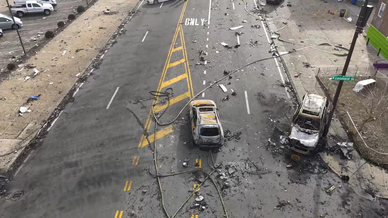 Debris and burnt cars could be seen stretched up the road. Picture: NTSB