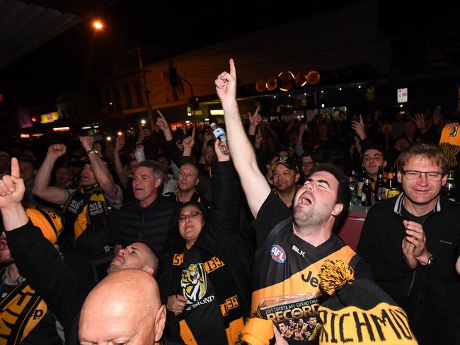 Tigers supporters celebrating along Swan St. Picture: AAP/James Ross