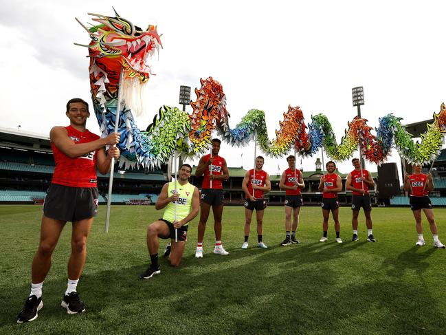 Sydney Swans players with a Chinese dragon on the SCG where a dragon dance performance will take place  ahead of the game this weekend against West Coast Eagles to celebrate the Chinese community and their contribution to Australian rules Football. L-R Oliver Florent, Tom McCartin, Joel Amartey, Braeden Campbell, Nick Blakey, James Rowbottom, Logan McDonald and Chad Warner. Photo by Phil Hillyard(Image Supplied for Editorial Use only - **NO ON SALES** - Â©Phil Hillyard )