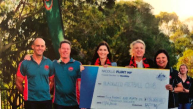 BIGGER THE BETTER: Boothby MP Nicolle Flint hands over another cheque