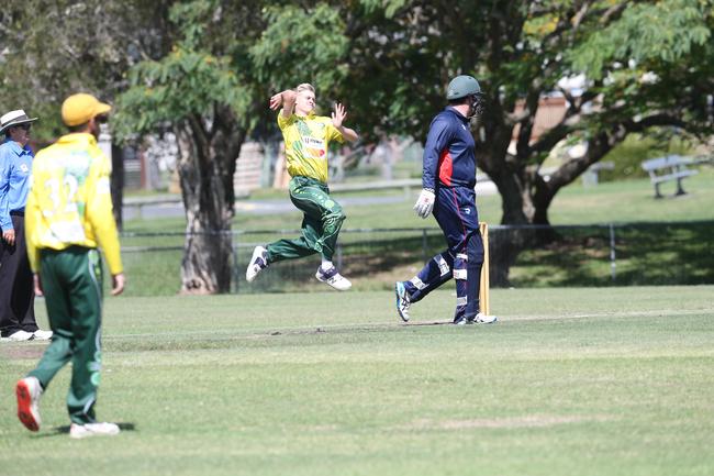 Ellis McCarthy runs in to bowl.