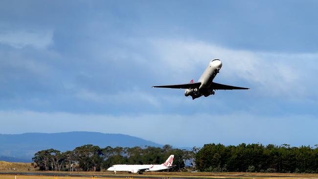 a Qantas plane takes off from Hobart Airport