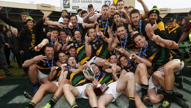 Jubilant Dromana players bunch for a premiership pic. Picture: Valeriu Campan