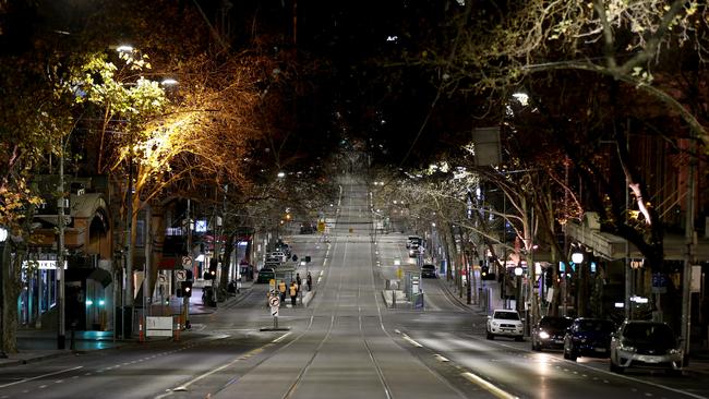 Collins Street in Melbourne after the 8pm curfew came into force on Sunday. Picture: Getty Images