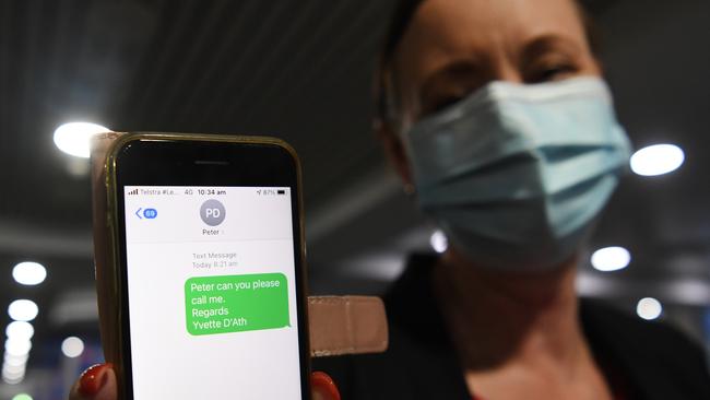 Health Minister Yvette D’Ath holds up her phone to the camera. Picture: NCA NewsWire / Dan Peled