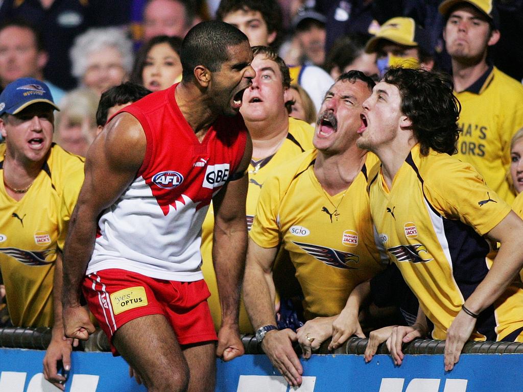 Michael O’Loughlin got up close and personal with West Coast fans in 2006 when he kicked a matchwinning goal to give the Swans a thrilling one-point victory in Perth and a home preliminary final to boot. Both sides of the fence gave as good as they got in this one, but the highlight has to be the vein popping out from our moustachioed mate’s neck. Photo: Phil Hillyard.