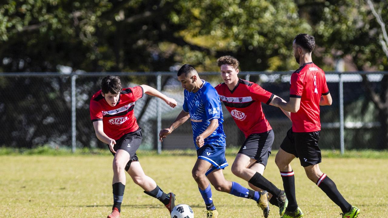 Rockville Rovers player Tahssin Al Qaso (centre) under pressure from Chinchilla Bears opposition in Div 1 Men FQ Darling Downs Presidents Cup football at West Wanderers, Sunday, July 24, 2022. Picture: Kevin Farmer