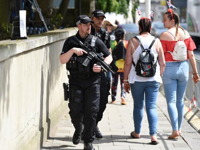 Armed police patrol on the High Street in Windsor on May 18, 2018, the day before the Royal wedding. Picture: AFP Photo / Oli Scarff