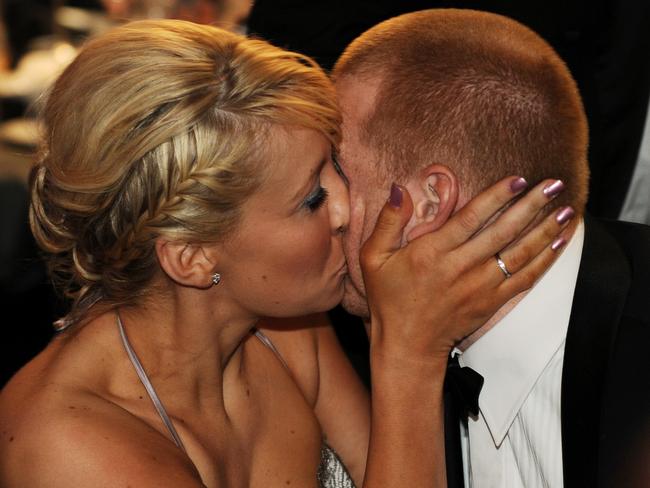 Former Western Bulldogs player Adam Cooney is congratulated by Haylea after winning the Brownlow.