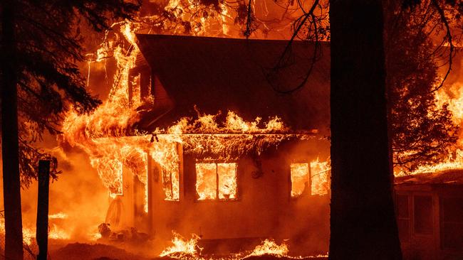 A home burns during the Dixie fire on July 24, 2021, in the Indian Falls neighborhood of unincorporated Plumas County, California. - The Dixie fire has now burned more than 200,000 acres and is the largest fire of the year for California. (Photo by JOSH EDELSON / AFP)