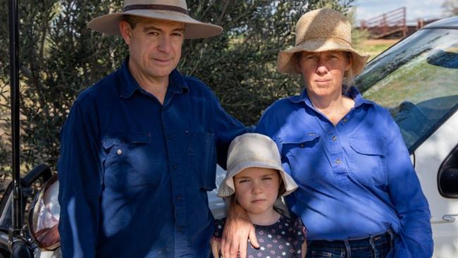 James Maunder and Justine McNally, with their daughter Emma, 9, on their property near Moree. Their 11 year old son Henry, is a boarder in Toowoomba and is stuck there due to border restrictions. Picture: Laura Kennedy