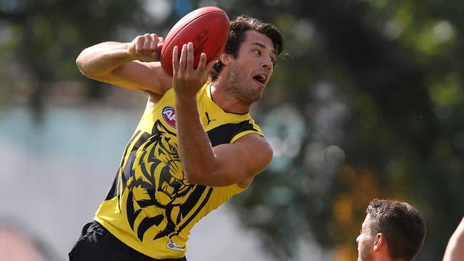 Alex Rance looks to fire off a handball at Richmond training. Picture: Wayne Ludbey