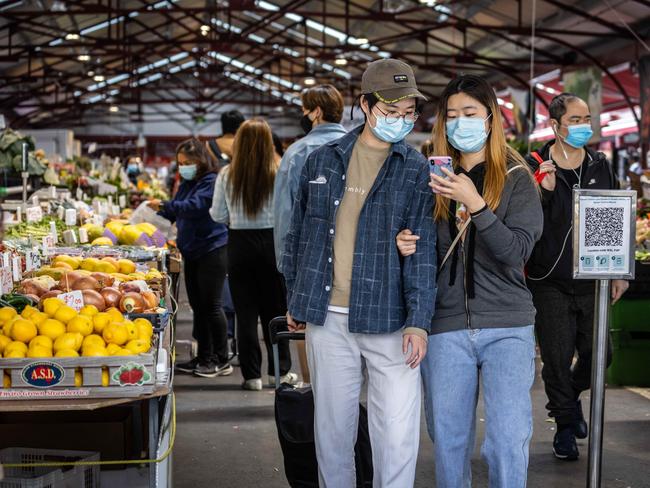 People seen wearing masks while shopping at Queen Victoria Market. Picture: Sarah Matray