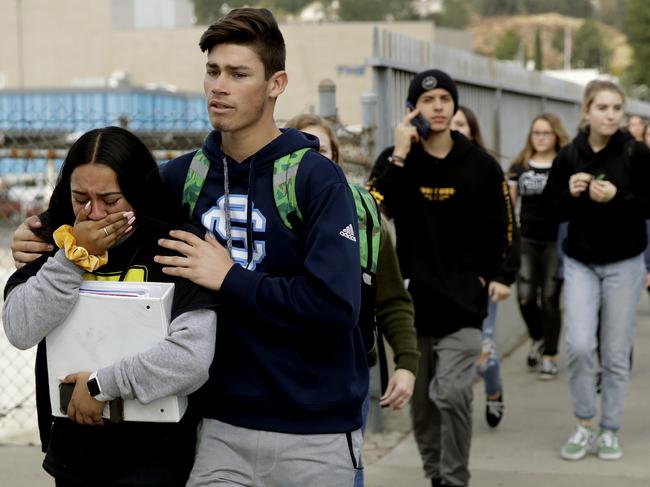 Students are escorted out of Saugus High School after reports of a shooting. Picture: AP