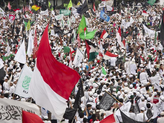 JAKARTA, INDONESIA - MARCH 31: Thousands of Indonesian Muslims protest against the Jakarta governor Basuki Tjahaja Purnama known widely as "Ahok" on March 31, 2017 in Jakarta, Indonesia.   The leader of one of the groups behind this protest and recent others was arrested Friday morning on suspicion of treason, as religious and political sentiments are increasingly contentious ahead of the Jakarta Governor election in April.(Photo by Ed Wray/Getty Images)