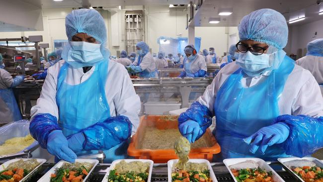 Meal preparation in the Lite n' Easy’s main assembly hall in Banyo.