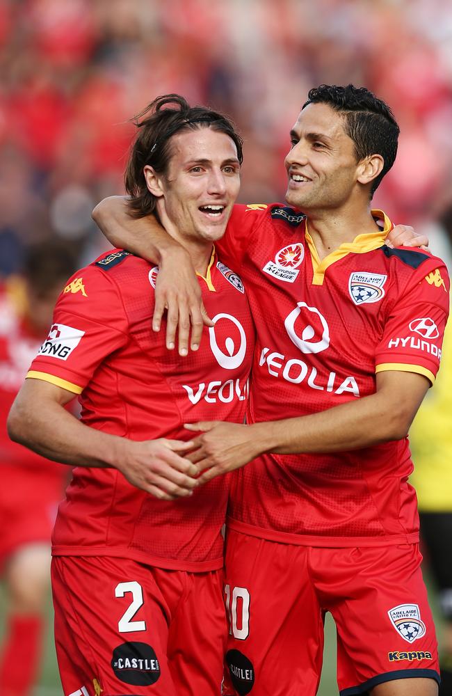 Marcelo Carrusca and Michael Marrone of Adelaide United celebrate.