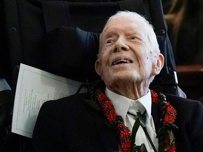 (FILES) In this file photo taken on November 29, 2023 former US president Jimmy Carter departs after the funeral service for former first lady Rosalynn Carter at Maranatha Baptist Church, in Plains, Georgia. Former US president Jimmy Carter will celebrate his 100th birthday on October 1, 2024. (Photo by Alex Brandon / POOL / AFP)