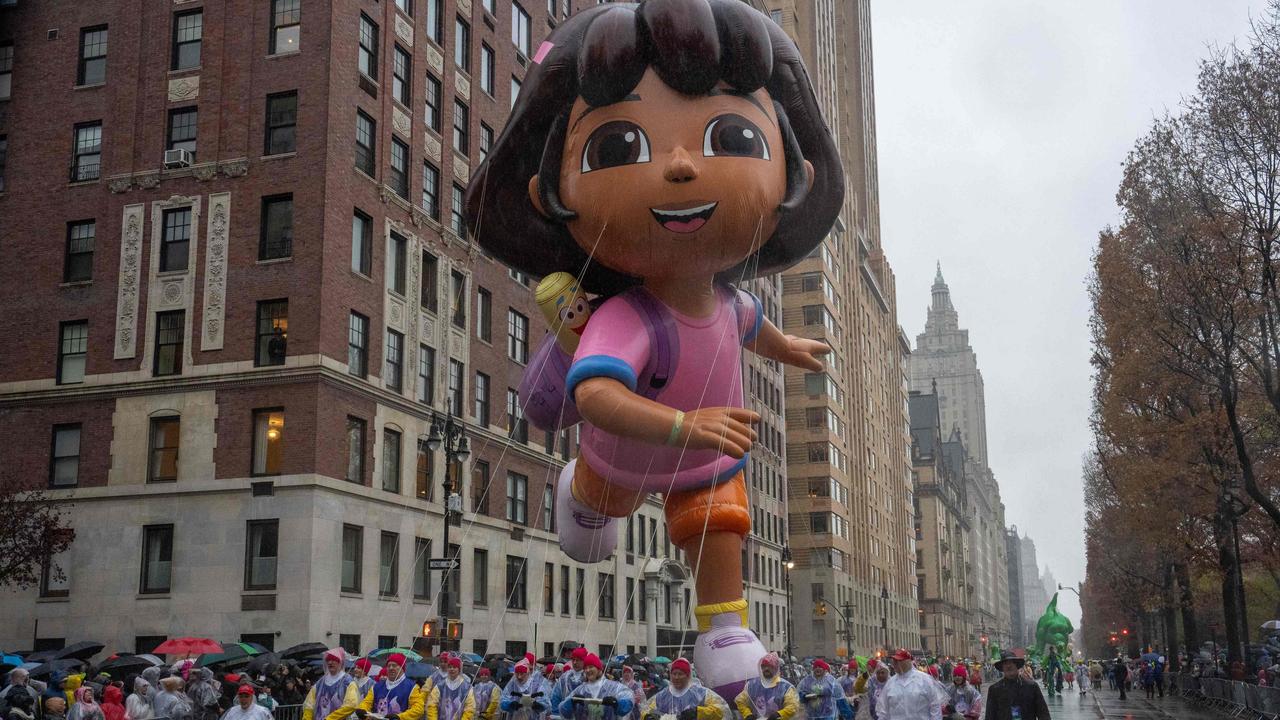 A Dora the Explorer balloon floats down the street. Picture: David Dee Delgado / AFP