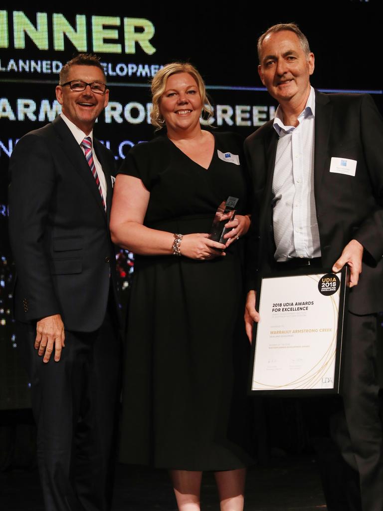 Sally Steinkrug and Mark Whinfield, right, from Warralily with award sponsor Darren Atkinson from Urbis.